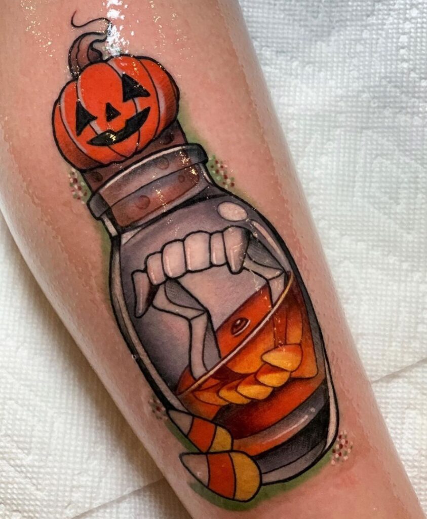Hand Jack O’ Lantern Tattoo with Vines jack o lantern tattoo ideas tattoo
