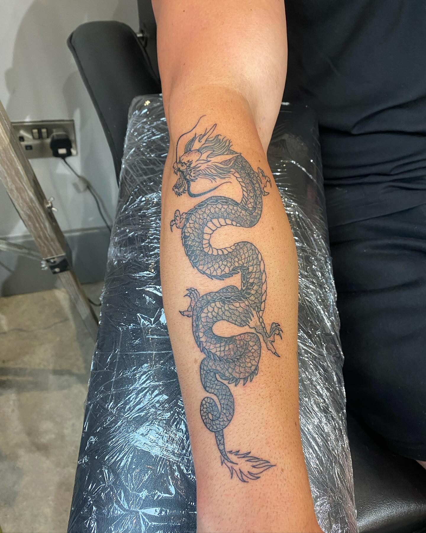Minimalist Japanese Dragon Forearm Tattoo