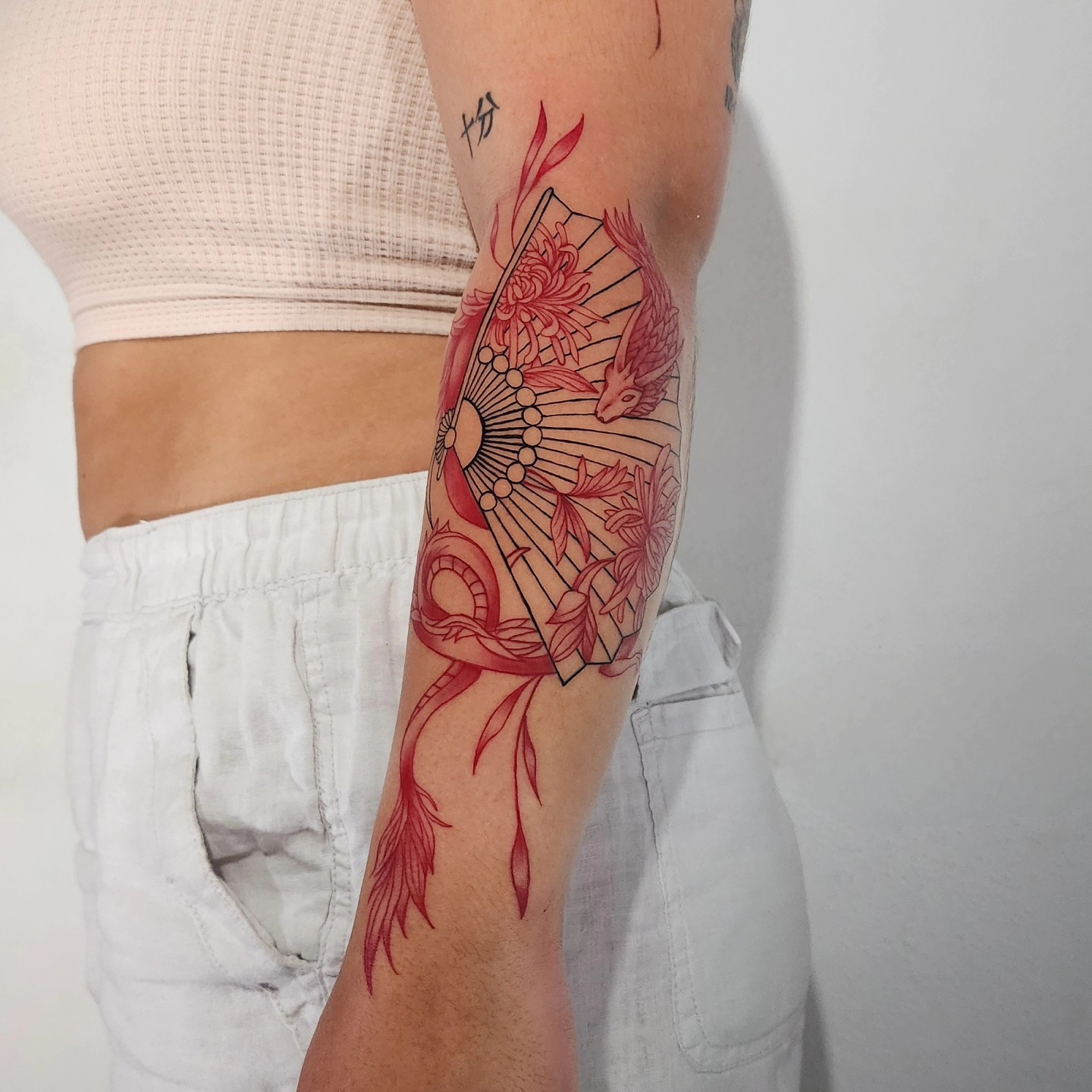 Red Japanese Dragon And Fan Tattoo