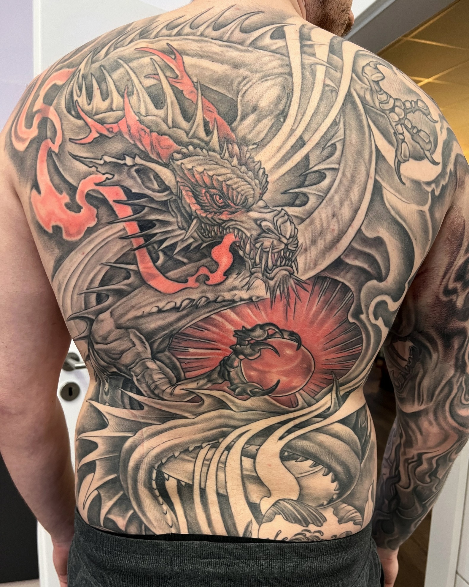 Red Sun Japanese Dragon Back Tattoo