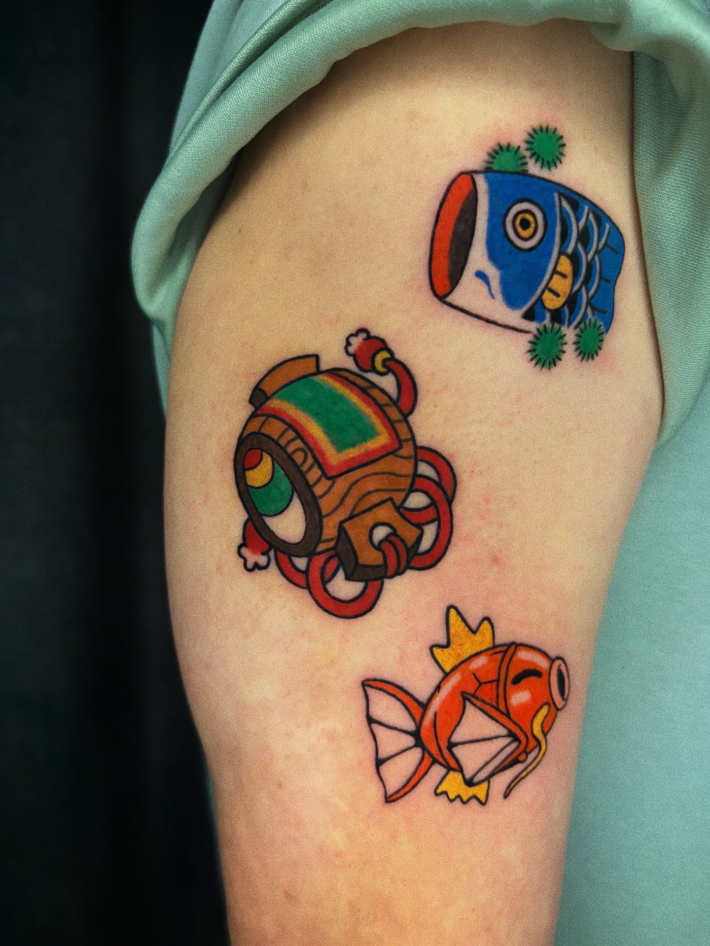 Japanese Koi and Toy Capsule Tattoo