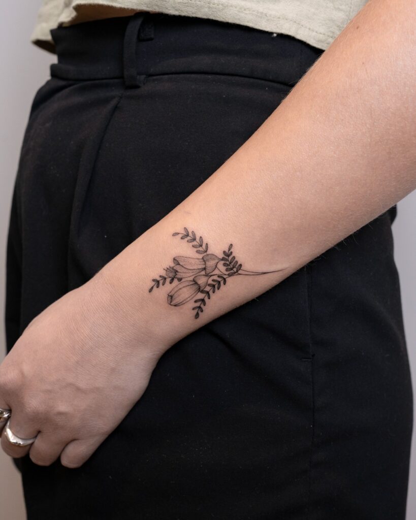 Kōwhai Flower Wrist Tattoo flower wrist tattoo ideas tattoo
