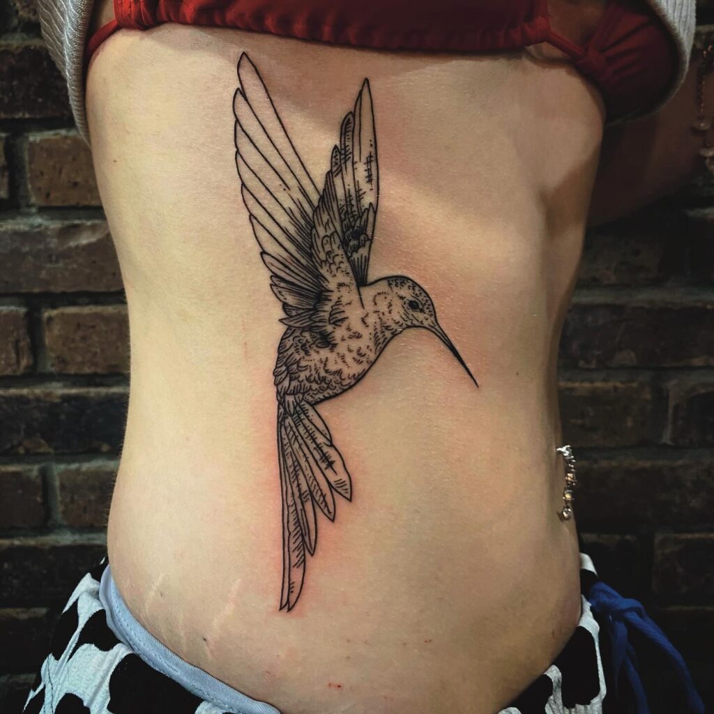 Large Linework Hummingbird on Ribcage hummingbird tattoos tattoo