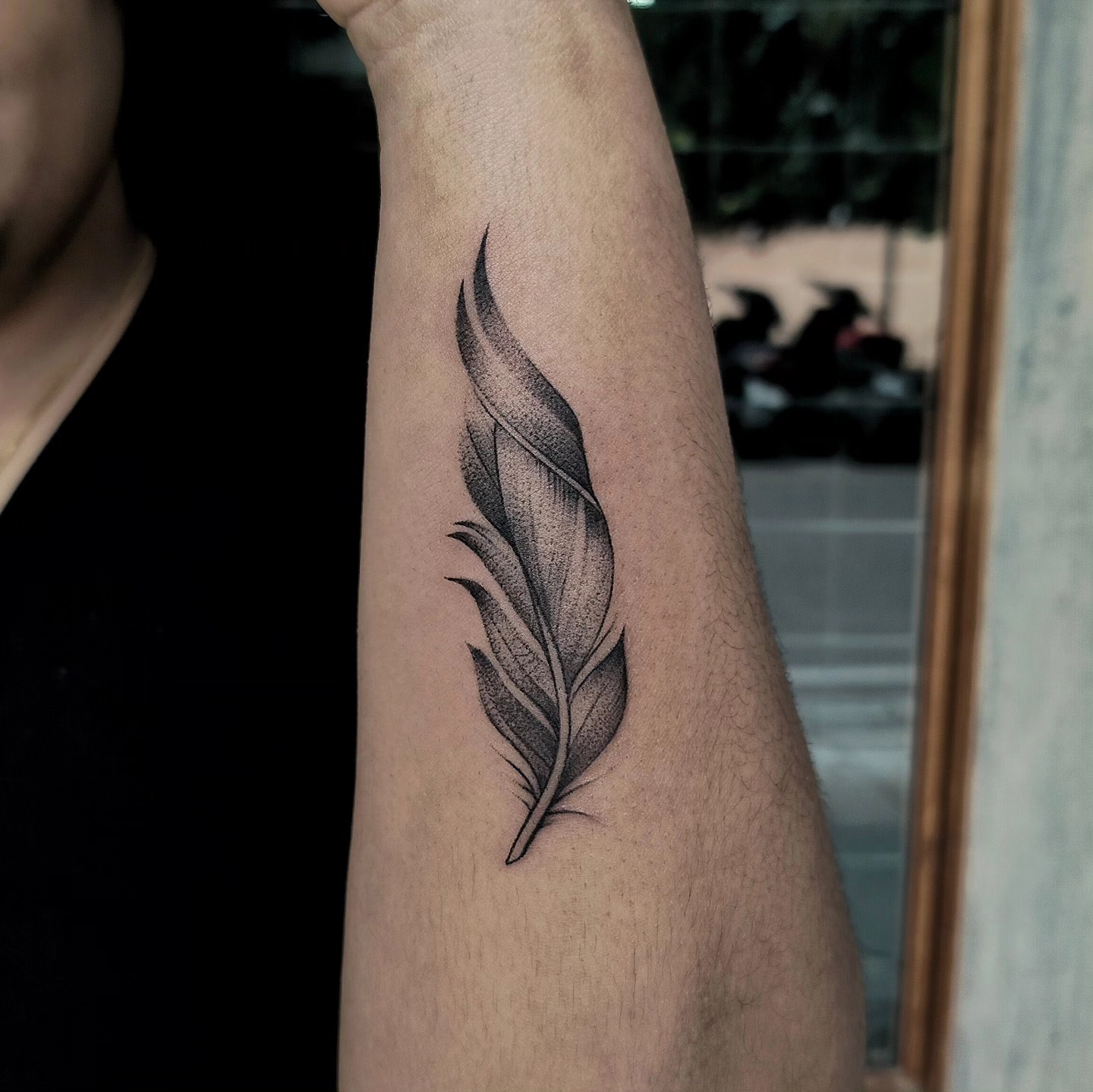 Black And Red Feather With Golden Sun Tattoo
