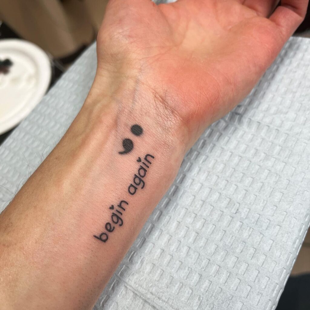 &ldquo;Begin Again&rdquo; Wrist Tattoo with Semi-Colon Symbol meaningful semicolon tattoo ideas tattoo