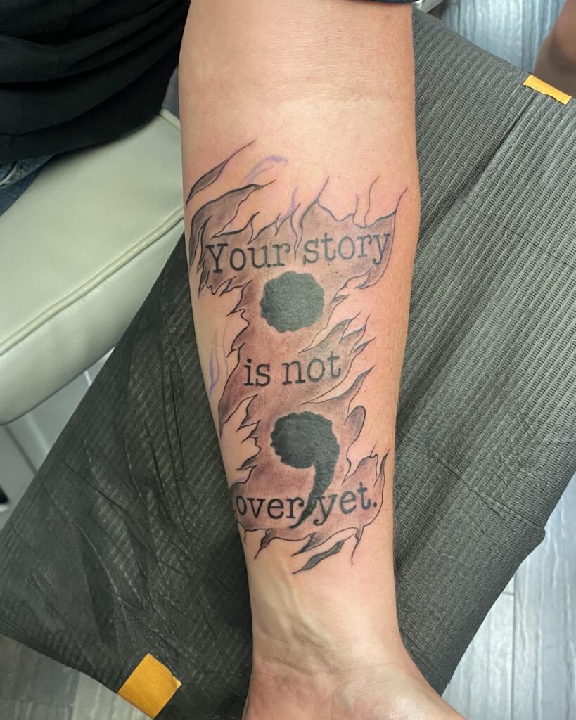 &ldquo;Your Story is Not Over Yet&rdquo; Semi-Colon Tattoo with Flames meaningful semicolon tattoo ideas tattoo