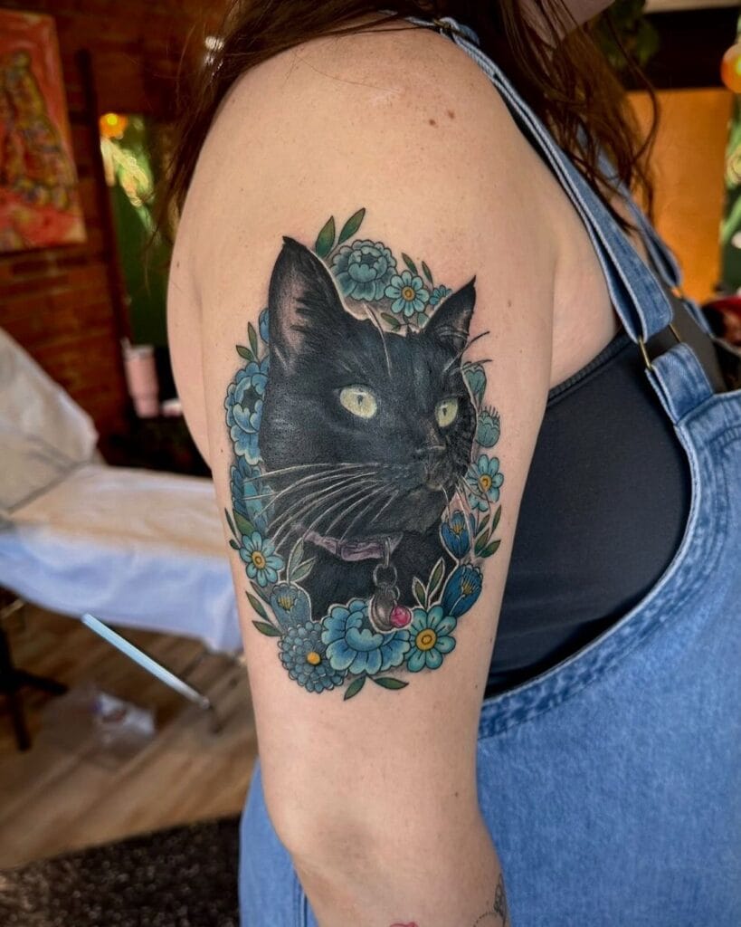 Lifelike Portrait Surrounded by a Wreath of Blue Flowers pet memorial tattoos tattoo