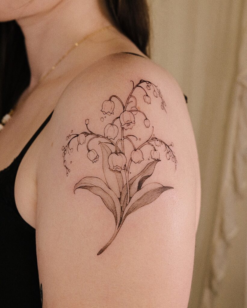 Lily of the Valley Shoulder Tattoo in Fine Line Style may birth flower tattoos tattoo