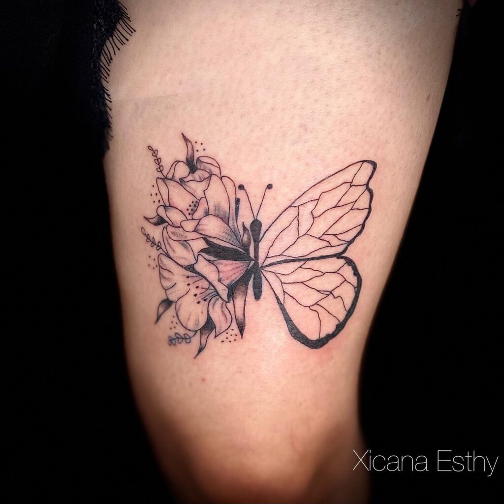 Linework Butterfly and Lily Tattoo half butterfly half flower tattoos tattoo