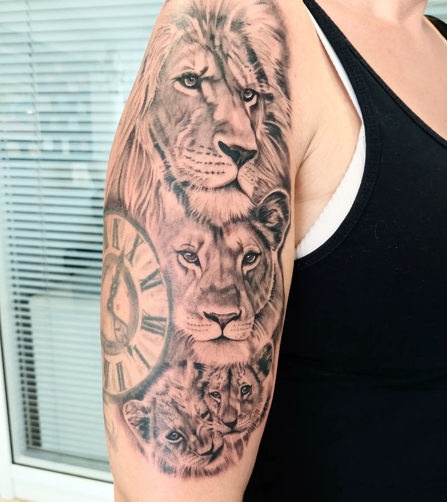 Lion Family and Roman Clock Tattoo lion family tattoos tattoo