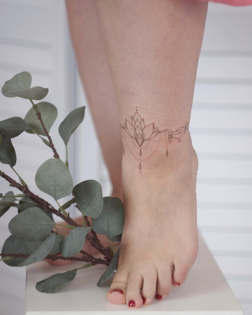 Elegant Anklet Tattoo With Butterfly Knot And Emerald Accent