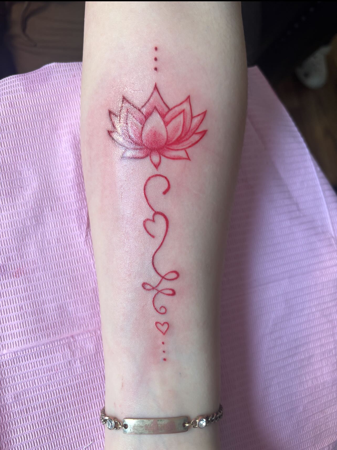 Lotus Flower and Heart Line Tattoo lotus flower tattoo ideas meaning tattoo