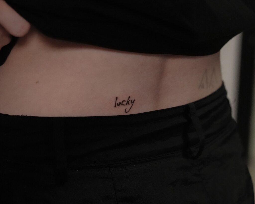 Lucky Script Waist Tattoo