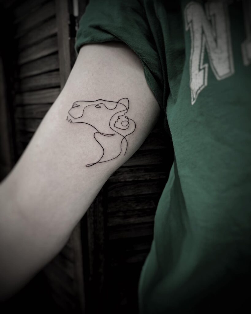 One line lion and person tattoo