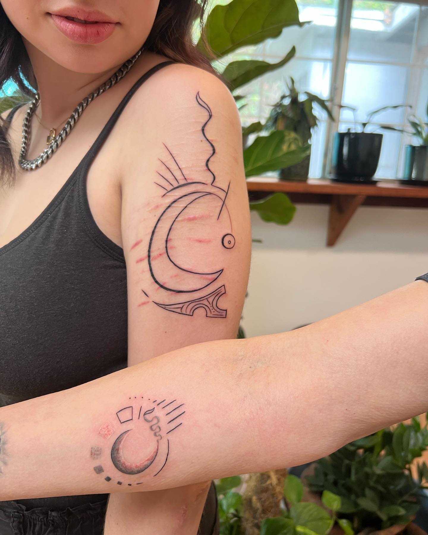 Matching Crescent Tattoos with Abstract Line Details unique mom and daughter tattoos tattoo