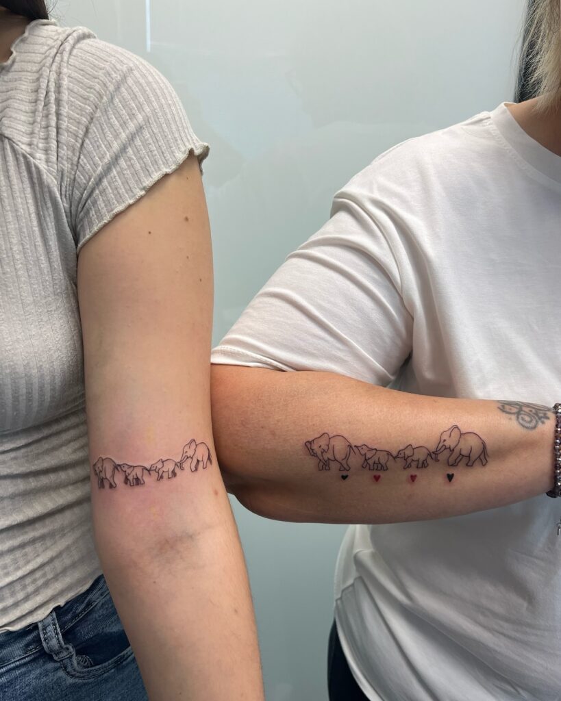 Matching Elephant Family Tattoos with Heart Trail elephant family tattoo ideas tattoo
