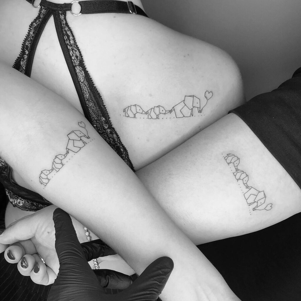 Matching Geometric Elephant Family Tattoos with Hearts elephant family tattoo ideas tattoo