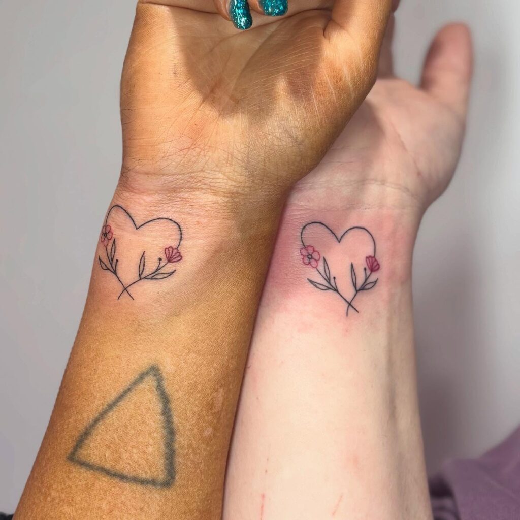 Matching Heart and Flower Wrist Tattoos flower wrist tattoo ideas tattoo