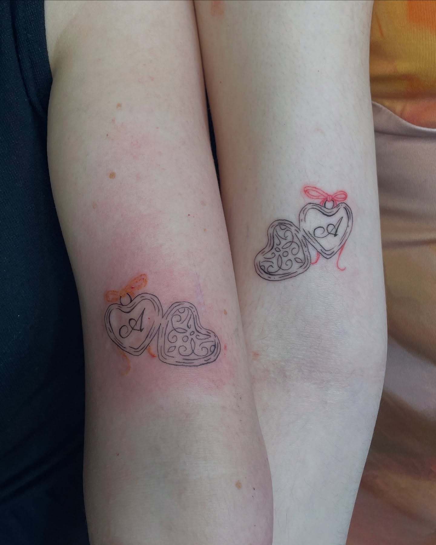 Matching Heart Locket Tattoos with Initials for Mother and Daughter unique mom and daughter tattoos tattoo