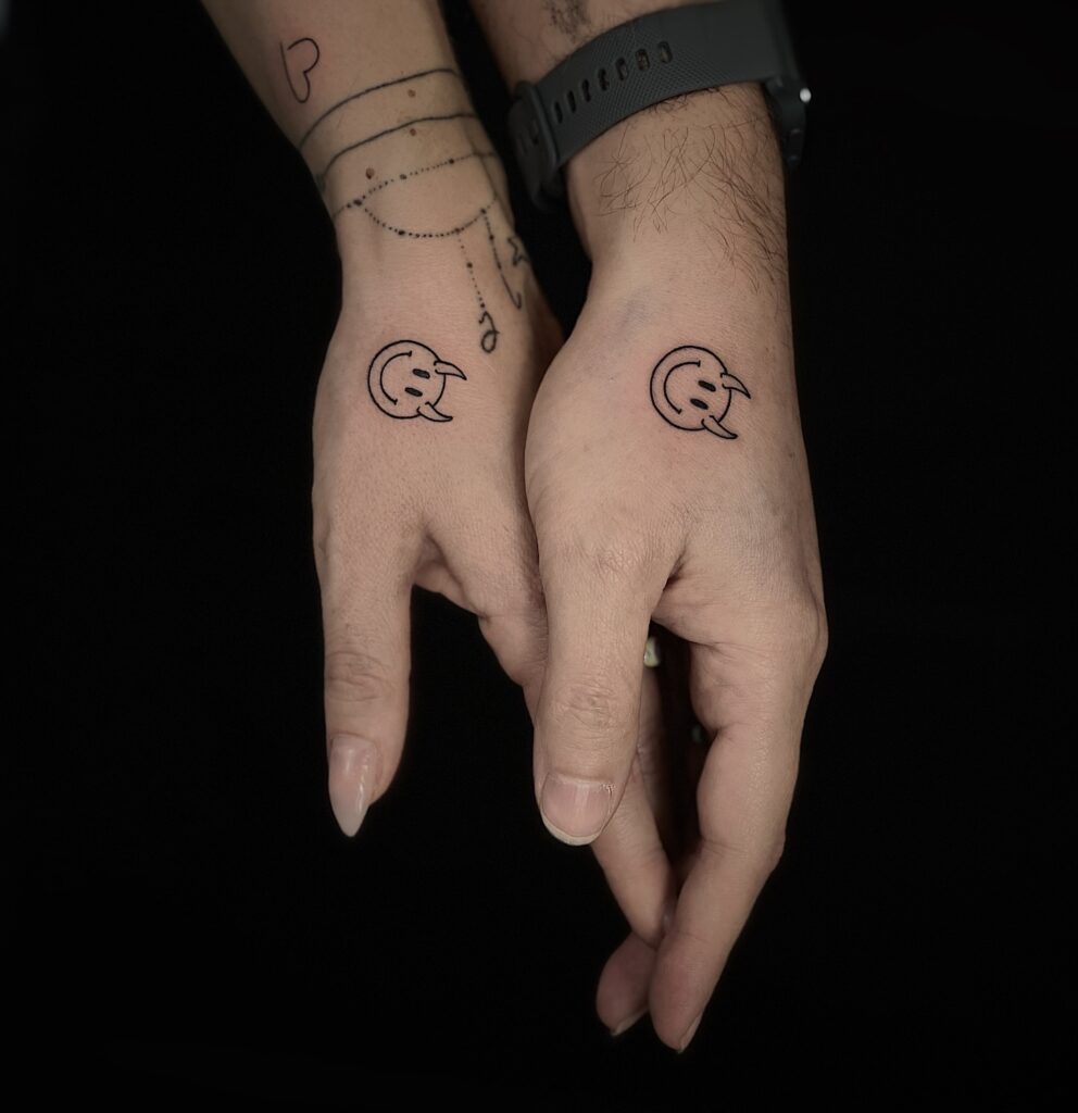 Matching Horned Smiley Tattoos