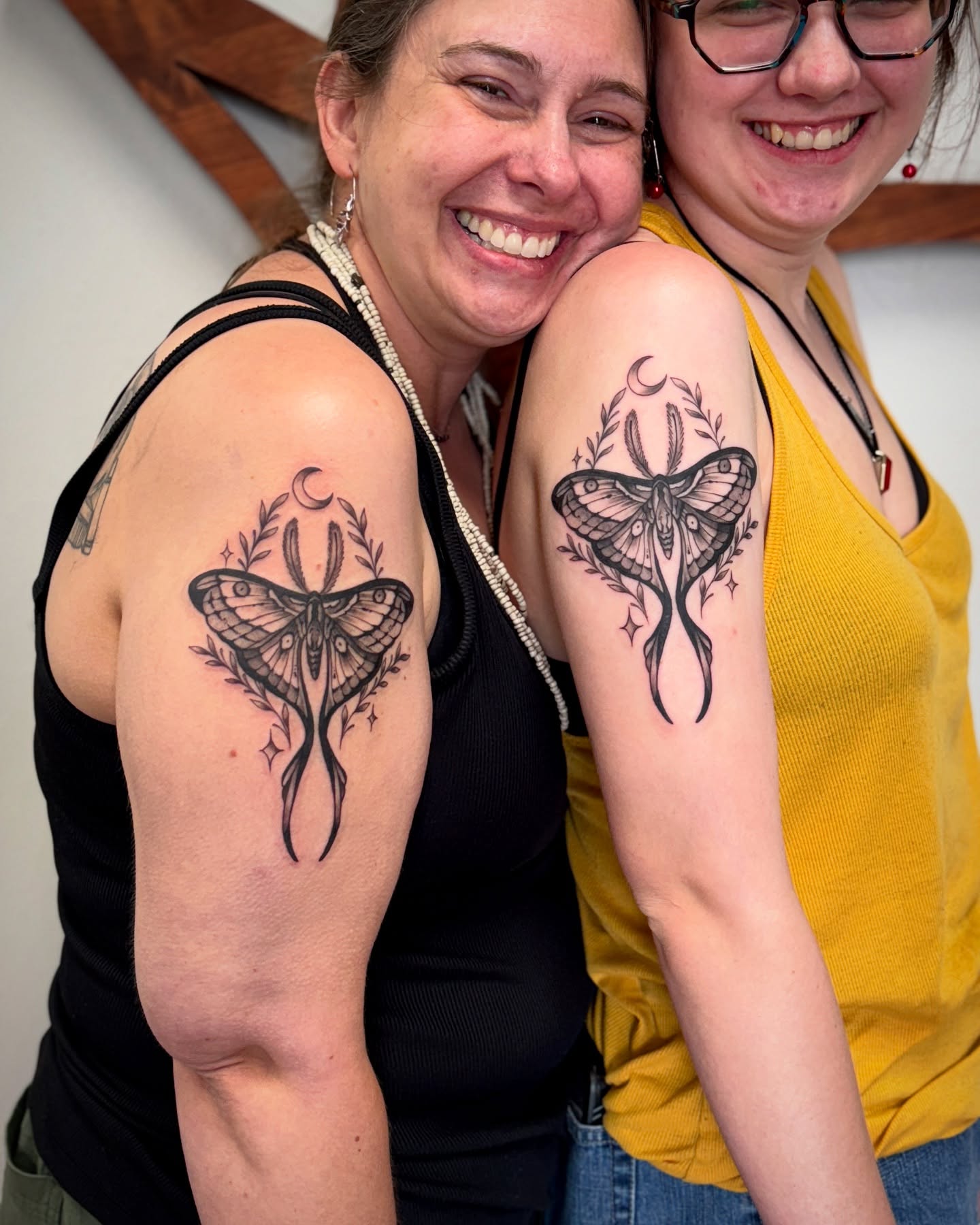 Matching Moth Tattoos with Crescent Moon for Mother and Daughter unique mom and daughter tattoos tattoo