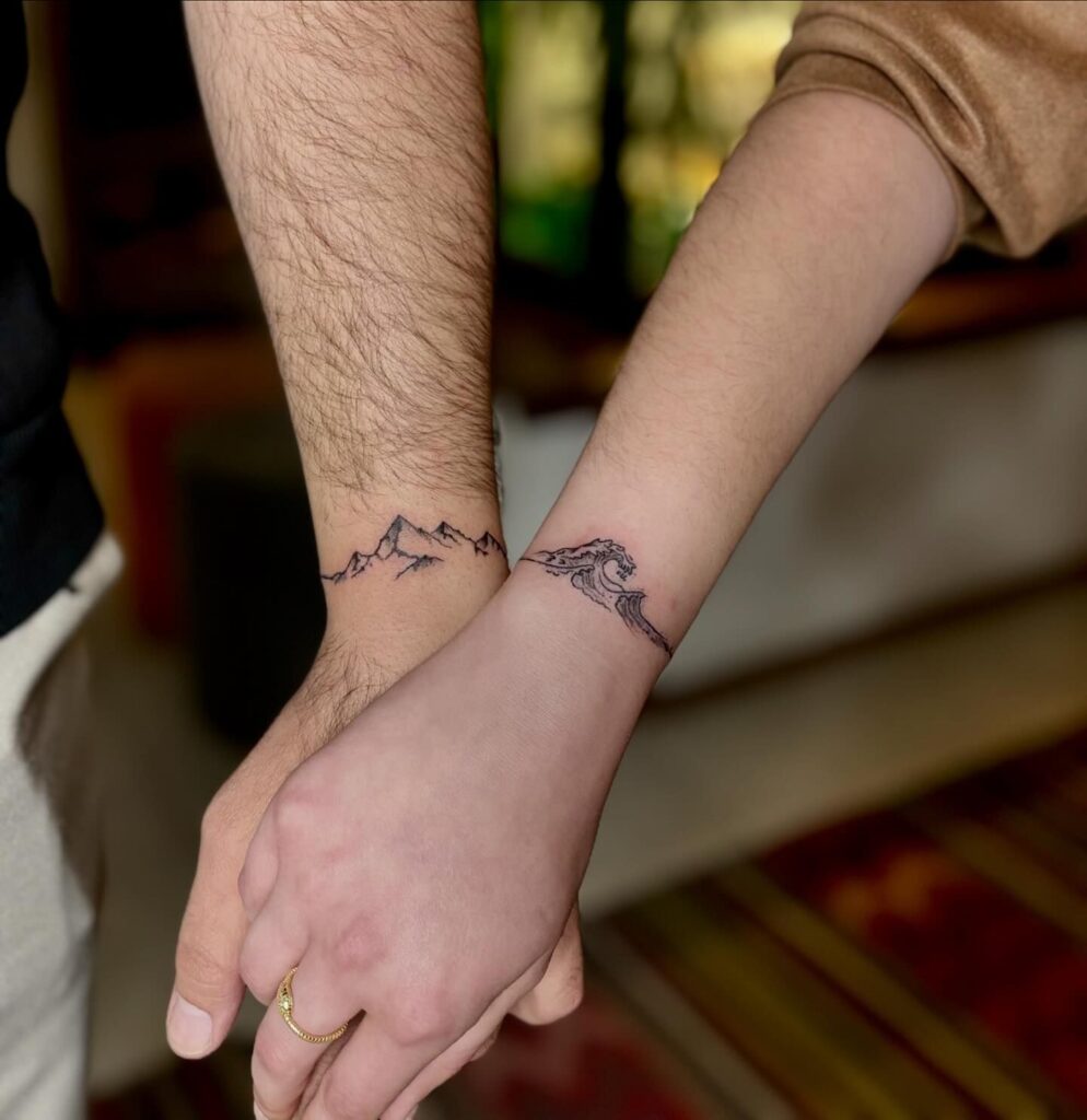 Matching Mountain and Wave Tattoos
