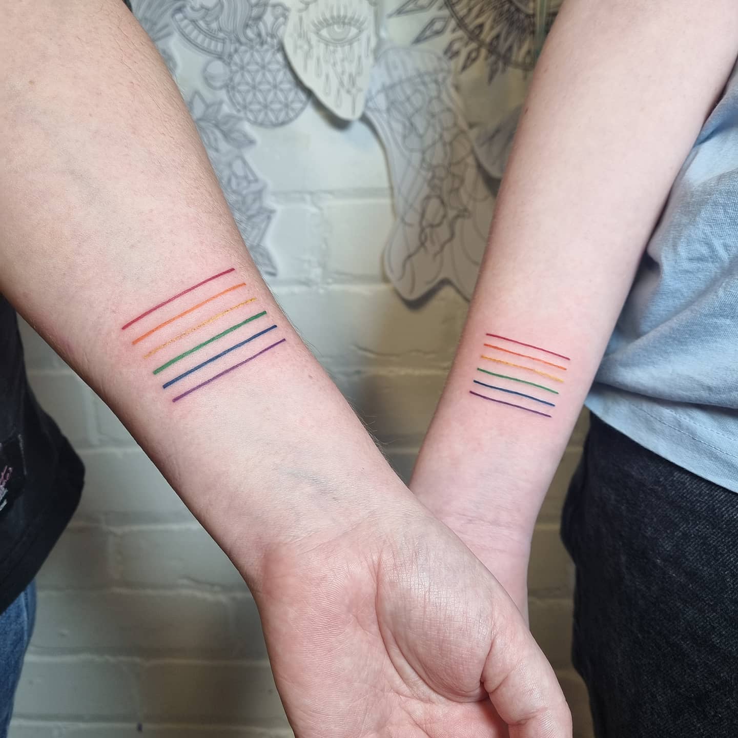 Matching Rainbow Line Tattoos for Mother and Daughter unique mom and daughter tattoos tattoo
