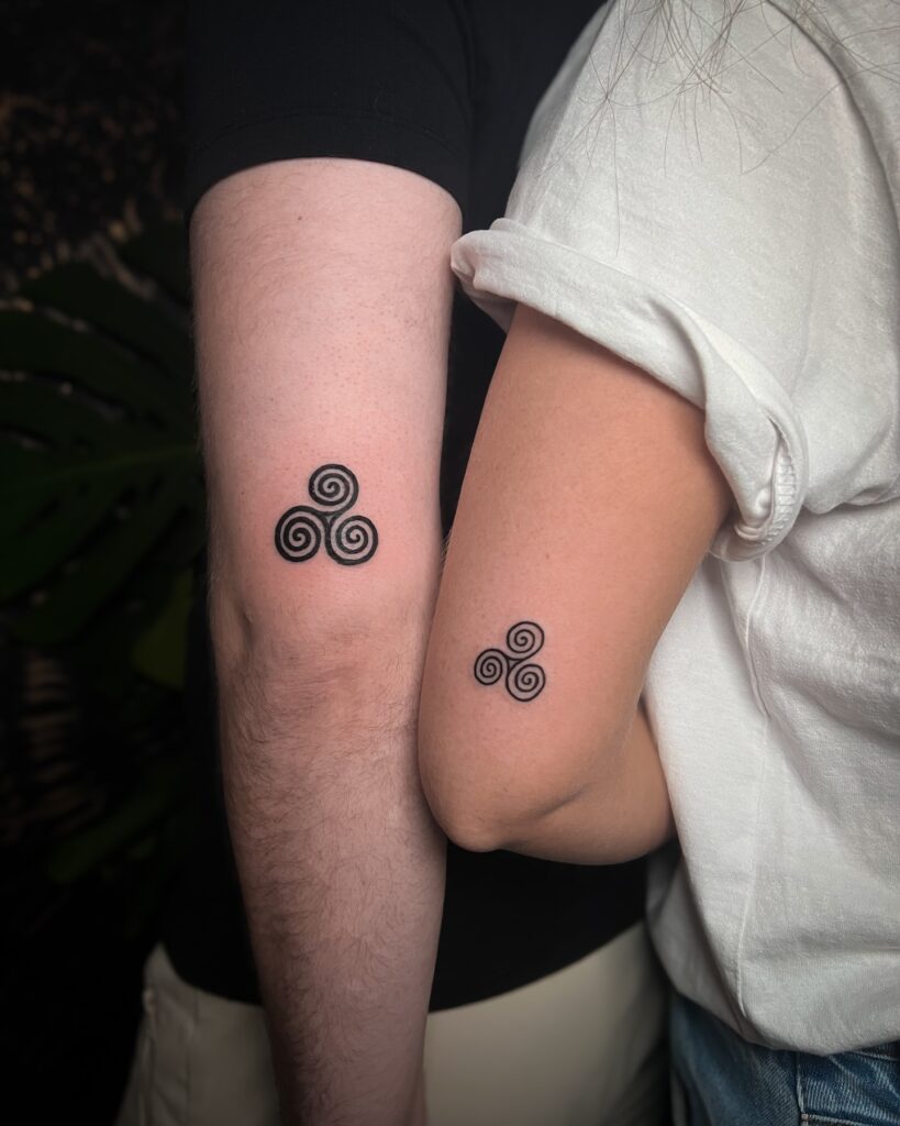 Matching Triskelion Symbol Tattoos symbols tattoos tattoo