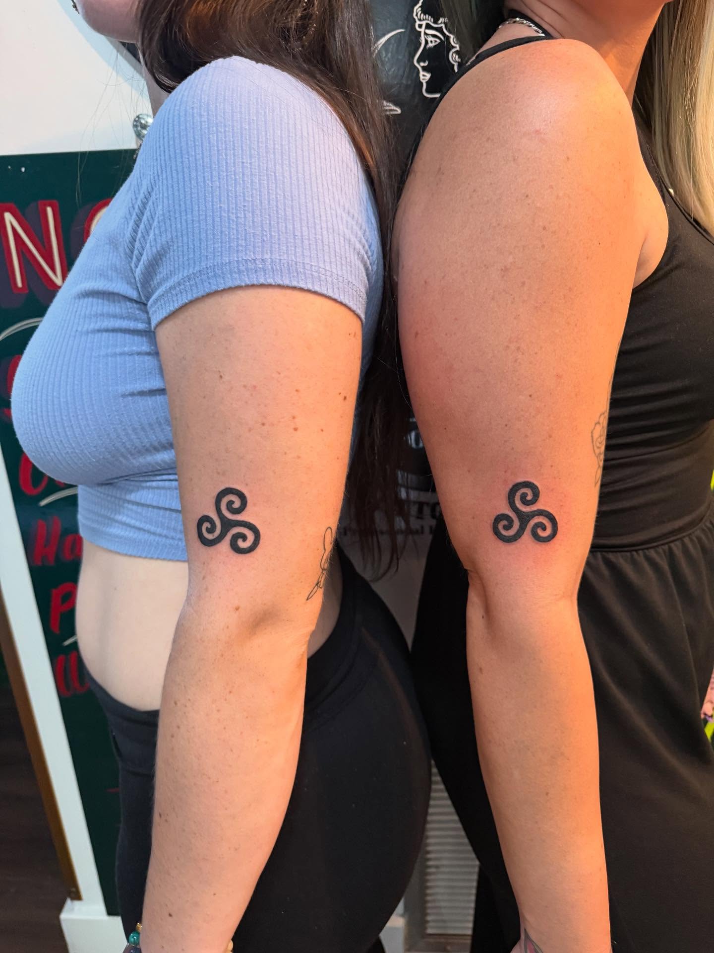 Matching Triskelion Tattoos on the Arms unique mom and daughter tattoos tattoo