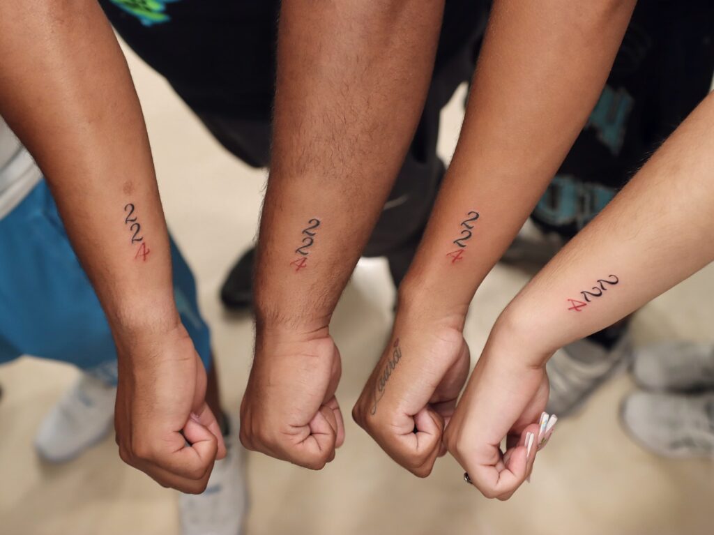 Meaningful Numerical Code Sequence matching family tattoo