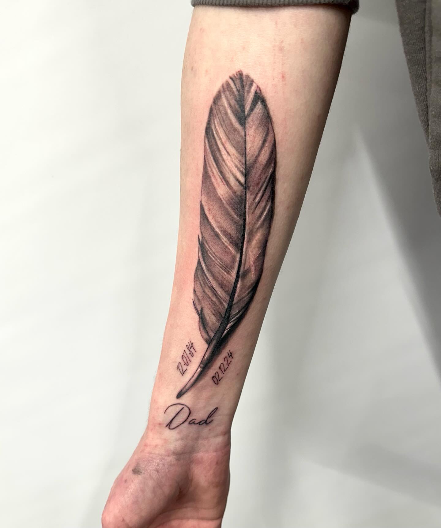 Soft Green Feather Tattoo