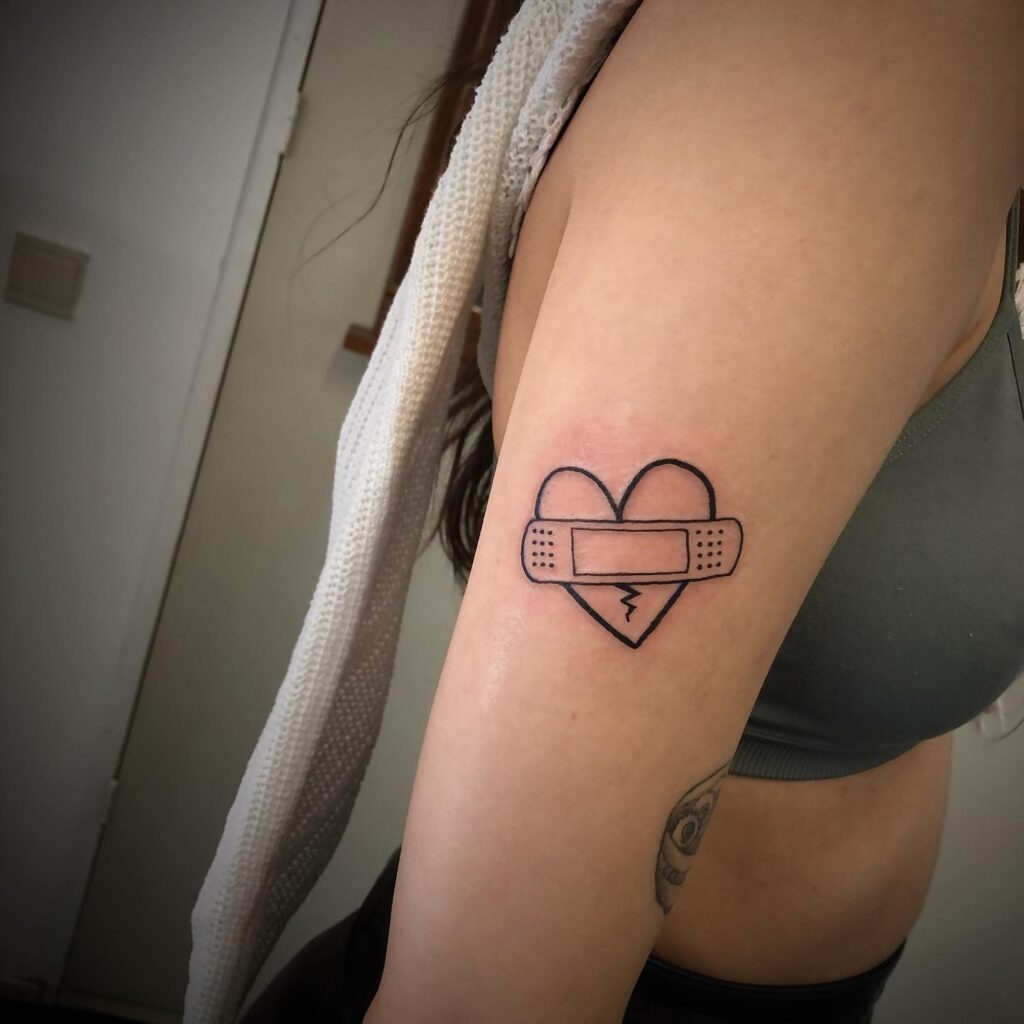 Heart and ‘X’ Elbow Tattoo small heart tattoo ideas tattoo