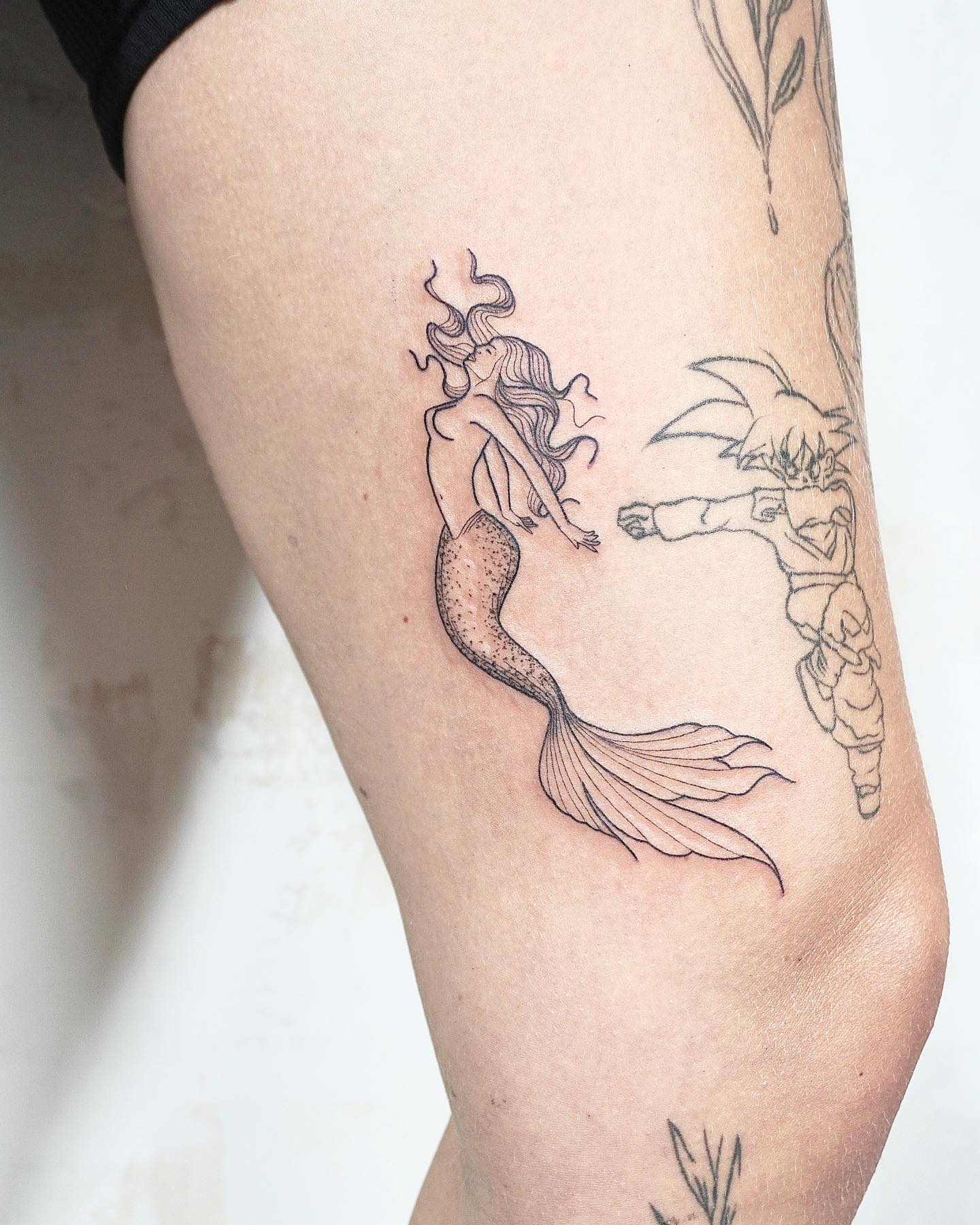 Fine Line Floating Mermaid Tattoo
