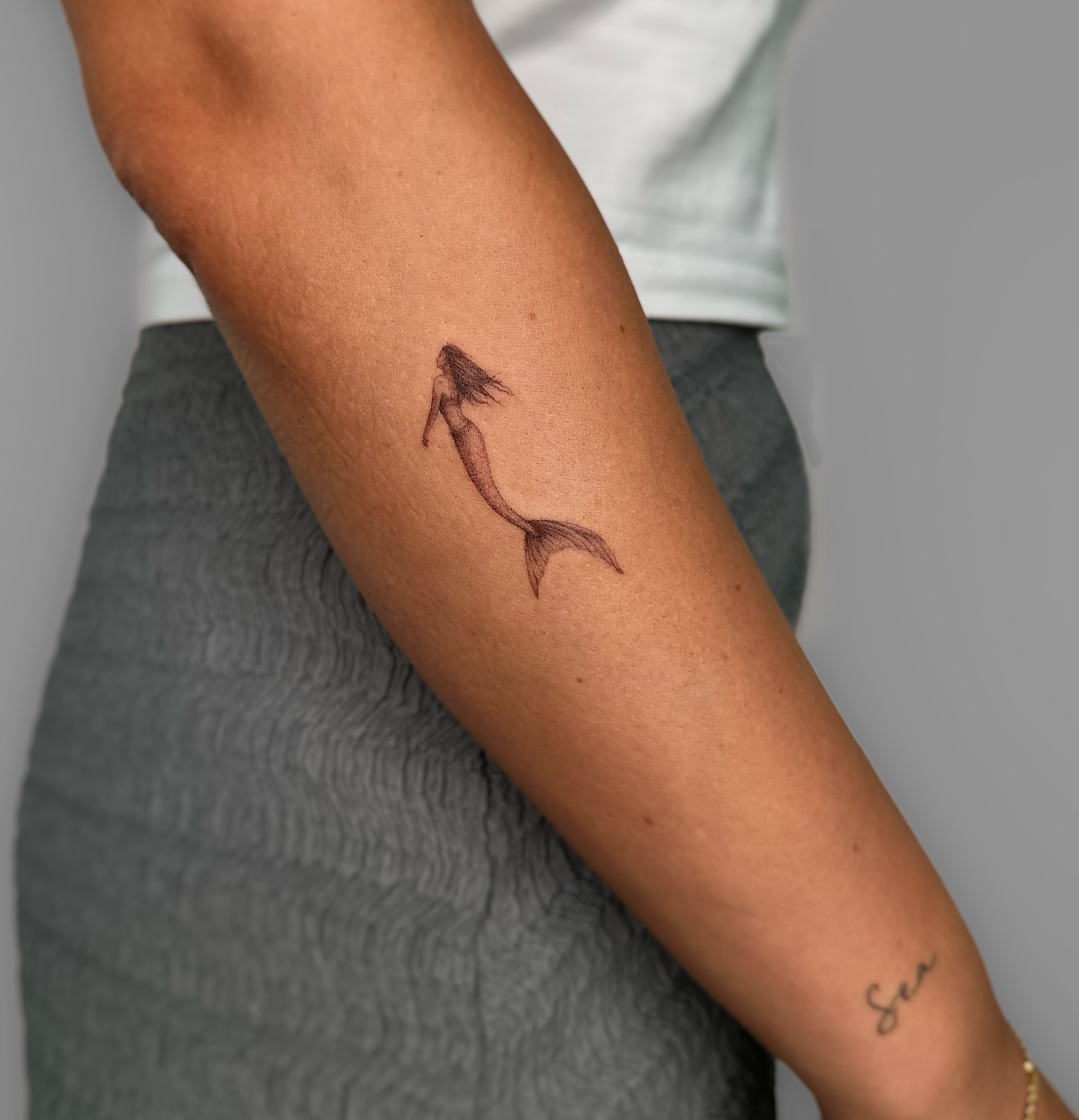 Minimalist Mermaid Silhouette Tattoo