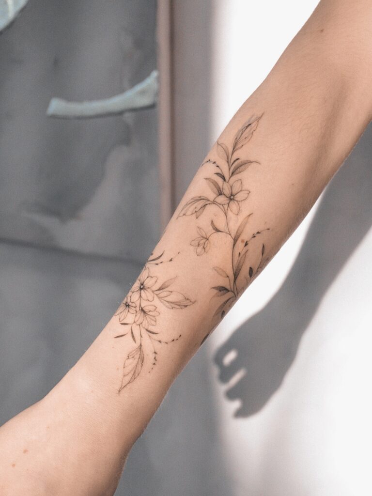 Micro Botanical Rose Behind the Ear fine line tattoo