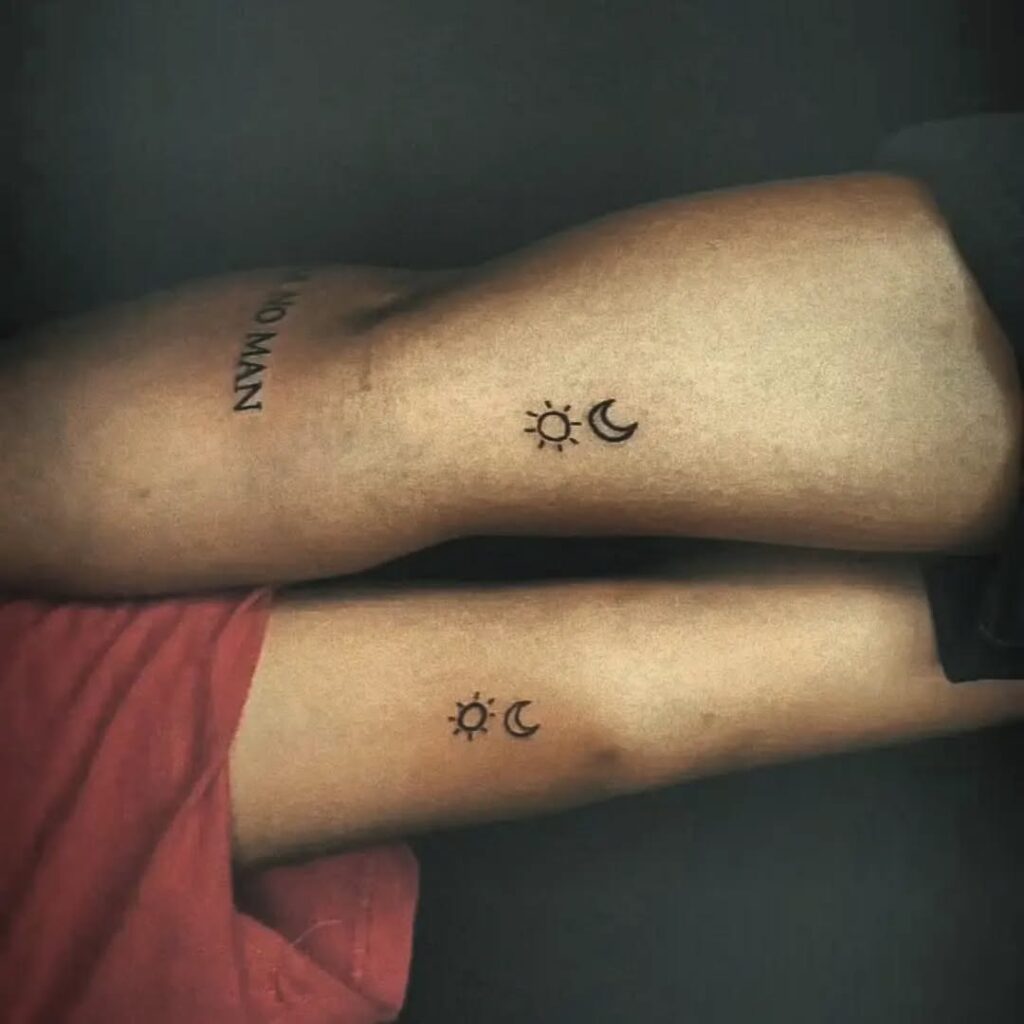 Tiny minimalist sun and moon tattoos on wrist