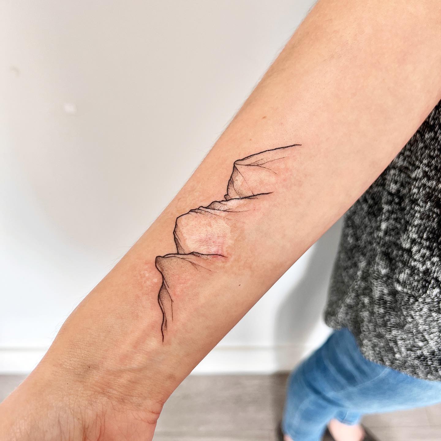 Minimal Continuous Mountain Line Tattoo mountain tattoos ideas tattoo