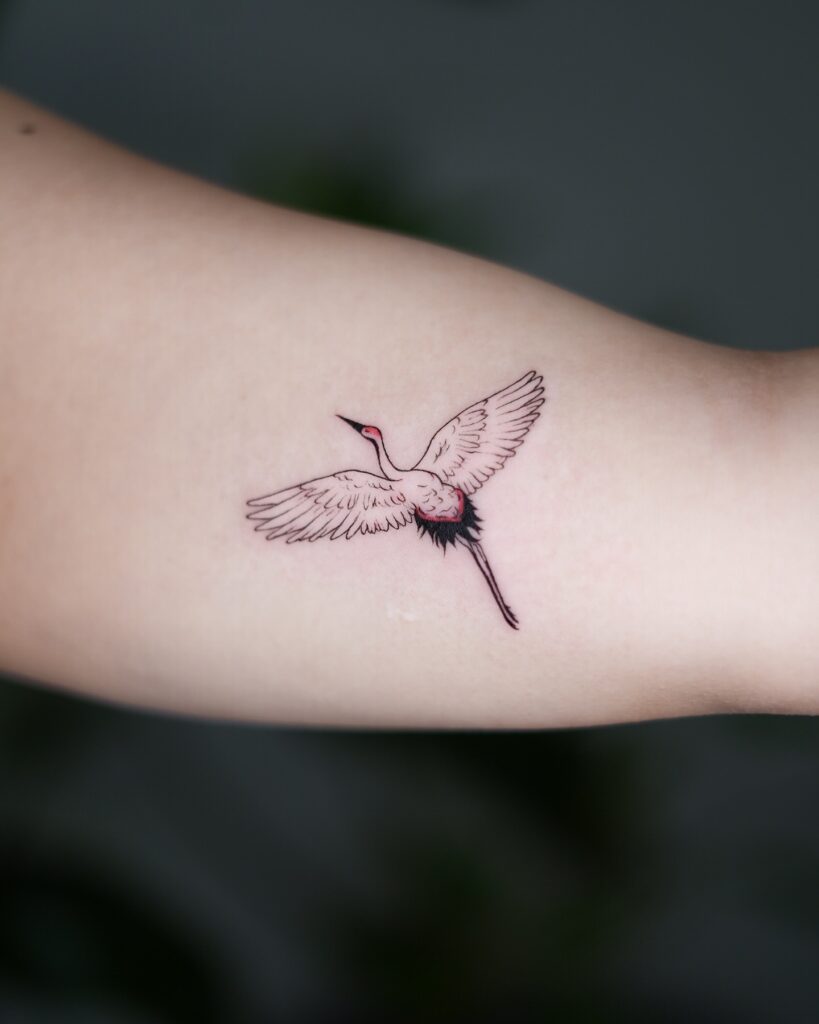 Minimal Crane in Flight Inner Arm Tattoo bird tattoo ideas for women with meaning tattoo