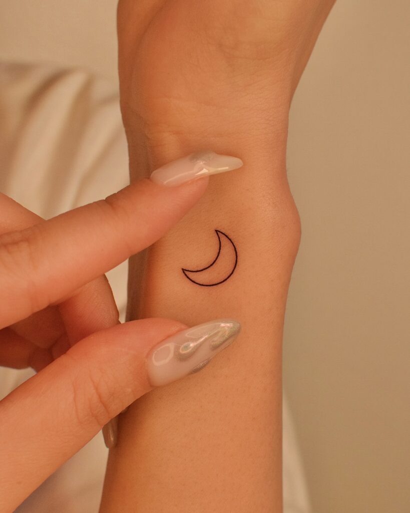 Minimal Crescent Moon Wrist Tattoo moon tattoos tattoo