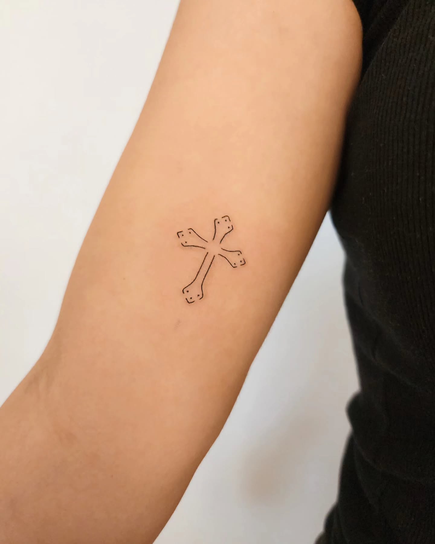 Minimal Decorative Cross Tattoo cross tattoos ideas for women tattoo