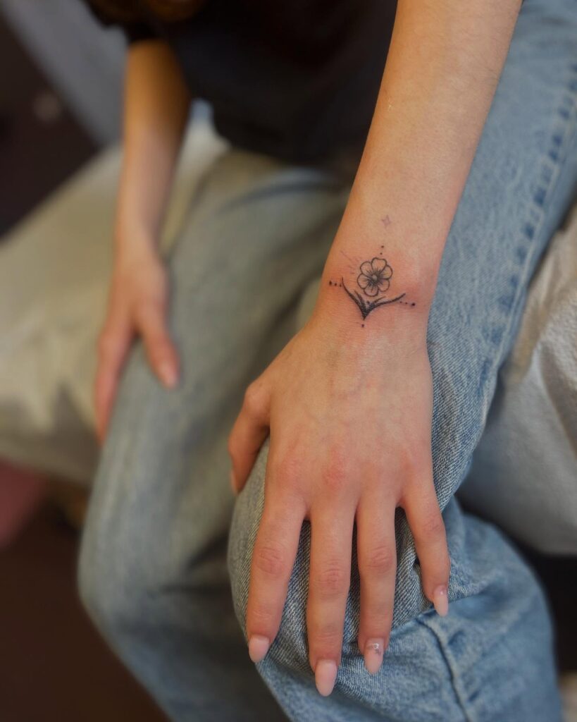 Minimal Floral and Dotwork Wrist Tattoo flower wrist tattoo ideas tattoo