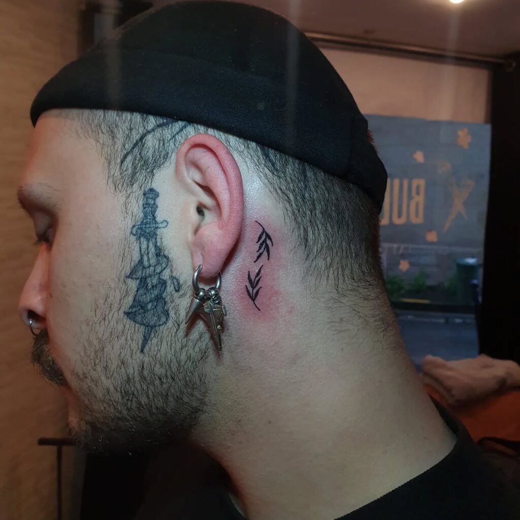 Bold Strength Symbol Behind the Ear behind the ear tattoo ideas for men tattoo