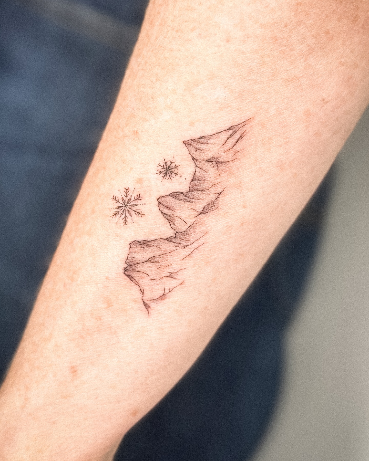 Minimal Mountain and Snowflake Tattoo mountain tattoos ideas tattoo