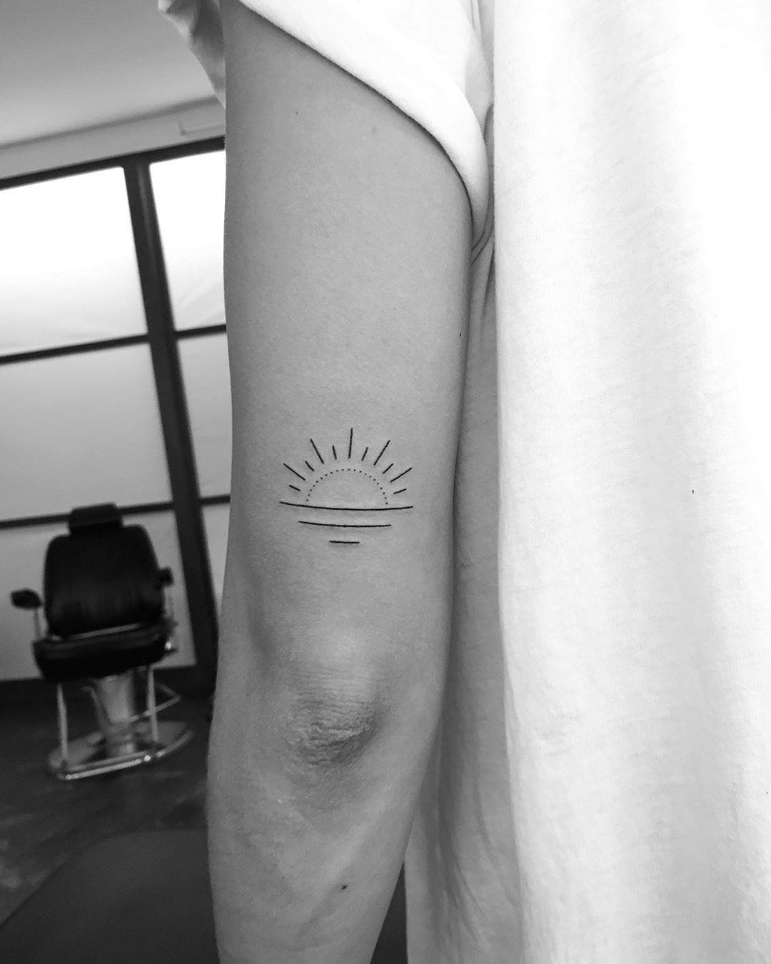 Minimal Tricep Sunrise Arch sunrise tattoo