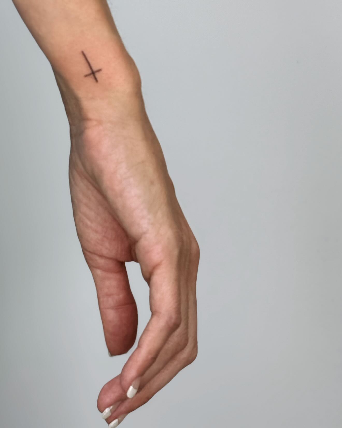 Minimal Wrist Cross Tattoo cross tattoos ideas for women tattoo