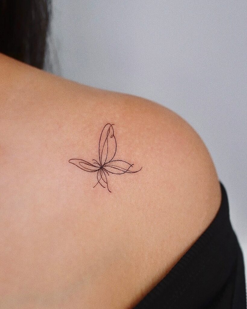 Minimalist Abstract Butterfly on Shoulder butterfly tattoo