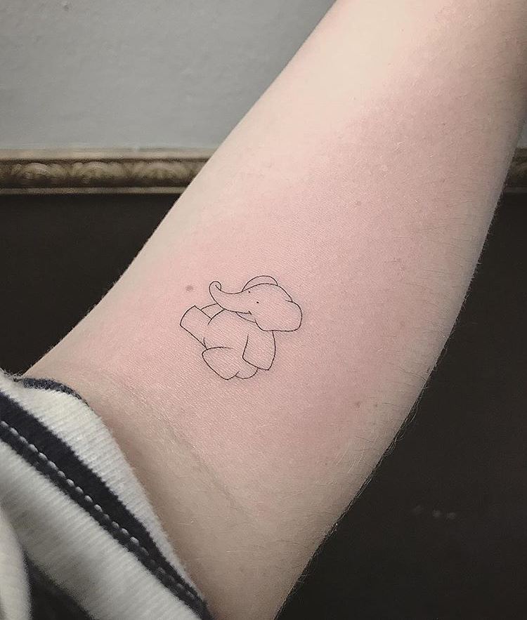 Minimalist baby elephant silhouette tattoo
