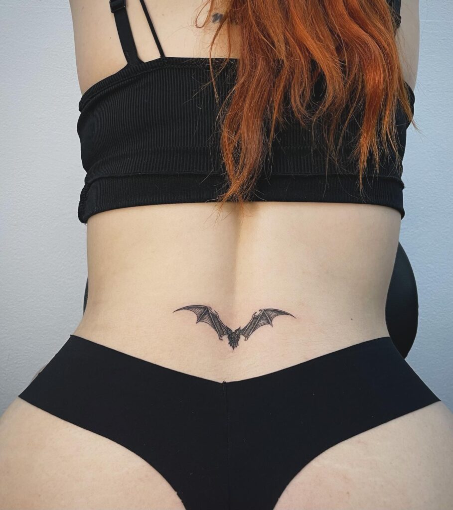 Delicate Floral Linework Lower Back Tattoo