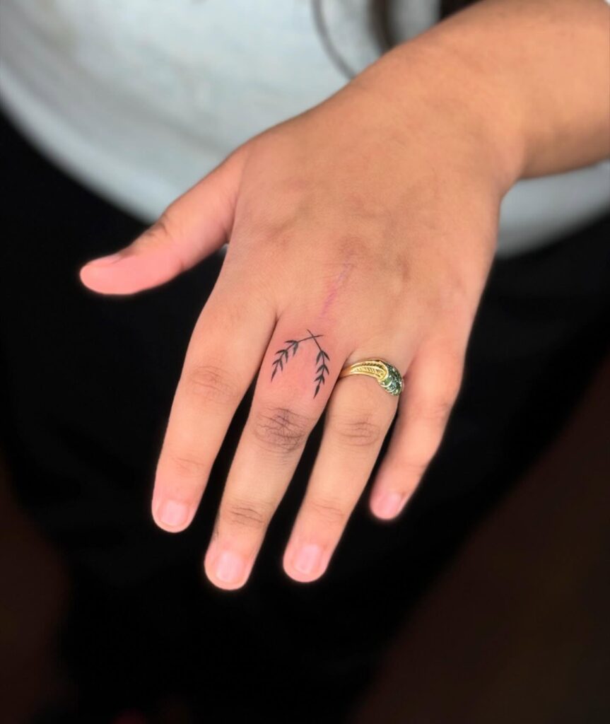 Bold Dagger Finger Tattoo