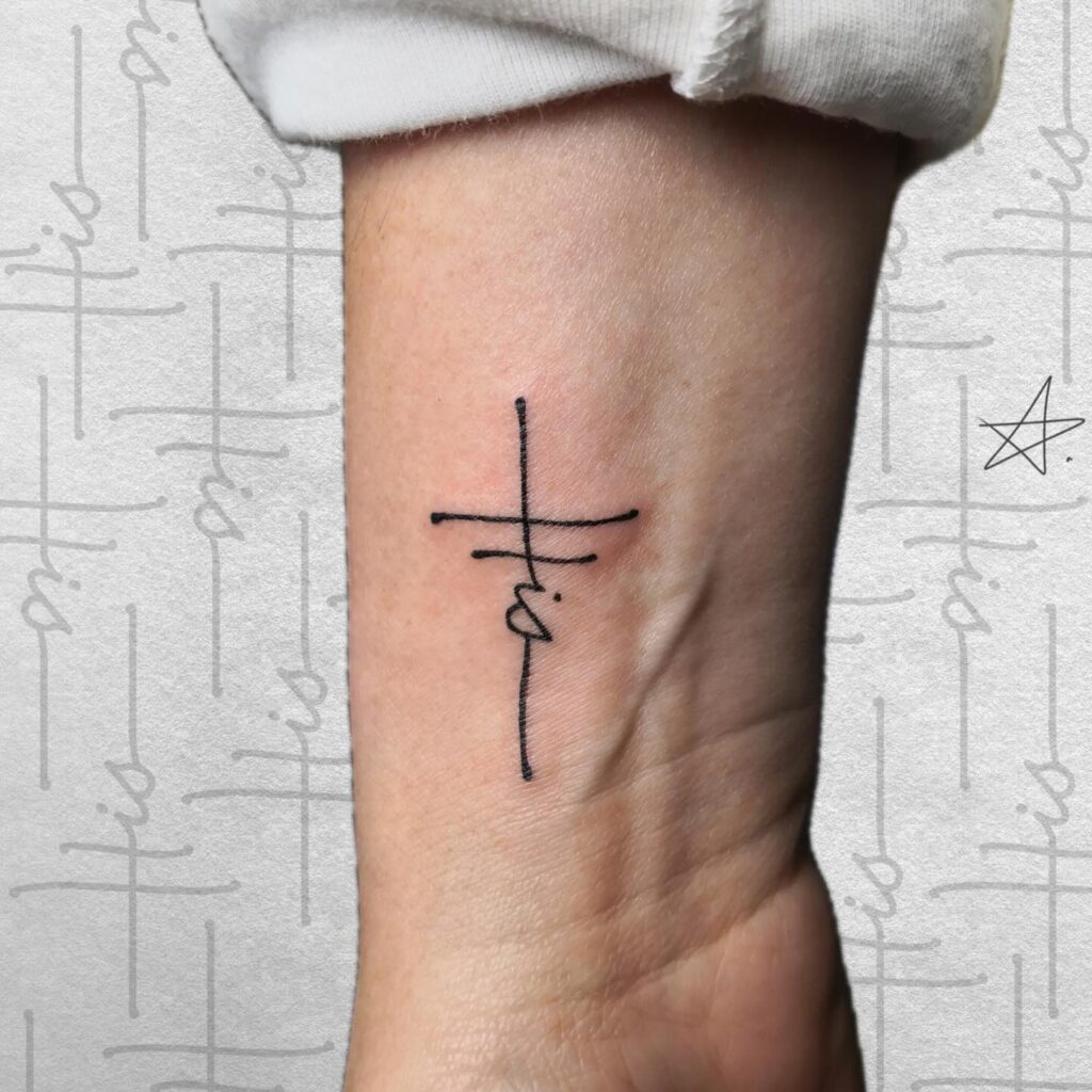 Minimalist Cross with &ldquo;His&rdquo; Script Wrist Tattoo cross tattoos for men tattoo